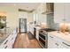 Modern kitchen featuring stainless steel appliances, granite countertops, and stylish white cabinetry at 4225 Maner Se St, Smyrna, GA 30080