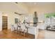 Modern kitchen featuring white cabinetry, granite countertops, a breakfast bar, and stainless appliances at 4225 Maner Se St, Smyrna, GA 30080