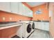 Functional laundry room with modern appliances, granite counters, and ample storage at 4225 Maner Se St, Smyrna, GA 30080