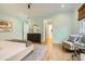 Spacious main bedroom with an ensuite bathroom and a sitting area with chairs at 4225 Maner Se St, Smyrna, GA 30080