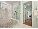 Luxurious shower with designer tile, a glass enclosure, and a built-in bench at 4225 Maner Se St, Smyrna, GA 30080