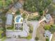 Aerial view of the community featuring a pool, tennis courts, and playground at 7497 Treehouse Ct, Douglasville, GA 30135