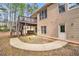 Backyard featuring a deck, patio, and trees at 7497 Treehouse Ct, Douglasville, GA 30135