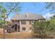 Captivating backyard with a two-level deck overlooking serene woods at 7497 Treehouse Ct, Douglasville, GA 30135