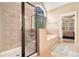 Lovely bathroom featuring a glass enclosed shower and soaking tub for luxurious comfort at 7497 Treehouse Ct, Douglasville, GA 30135
