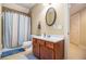 Bathroom featuring a vanity with wooden cabinets and a shower with curtain at 7497 Treehouse Ct, Douglasville, GA 30135