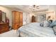 Spacious bedroom featuring wood furniture, tray ceiling, and natural light at 7497 Treehouse Ct, Douglasville, GA 30135