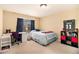 Spacious bedroom with carpeted floors and a large window offering plenty of natural light at 7497 Treehouse Ct, Douglasville, GA 30135