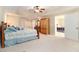 Bedroom boasting natural light, wood furniture and tray ceiling at 7497 Treehouse Ct, Douglasville, GA 30135