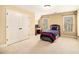 Comfortable bedroom with ample closet space and windows offering great natural light at 7497 Treehouse Ct, Douglasville, GA 30135