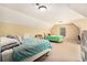 Spacious bedroom with neutral tones, two beds, and a cozy, carpeted floor at 7497 Treehouse Ct, Douglasville, GA 30135