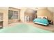 Bright bedroom featuring two beds, a window, and a neutral, carpeted floor at 7497 Treehouse Ct, Douglasville, GA 30135