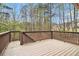 Spacious wood deck with trees surrounding it providing a private view at 7497 Treehouse Ct, Douglasville, GA 30135