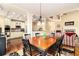 Open concept featuring dining room leading to kitchen, living room and staircase at 7497 Treehouse Ct, Douglasville, GA 30135