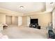 Spacious living area featuring plush carpeting and recessed lighting at 7497 Treehouse Ct, Douglasville, GA 30135