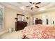 Well-lit main bedroom featuring classic furnishings and neutral paint, for a bright and airy feel at 7497 Treehouse Ct, Douglasville, GA 30135
