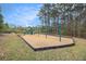 The neighborhood playground is surrounded by trees and has playground equipment, swings, and benches at 7497 Treehouse Ct, Douglasville, GA 30135