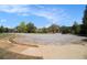 A cul-de-sac features mature trees and landscaping as well as multiple homes in this quiet neighborhood at 7497 Treehouse Ct, Douglasville, GA 30135