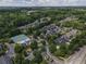 Community aerial view with tennis courts, a pool, manicured landscaping, and townhouses at 2630 Milford Ln, Alpharetta, GA 30009