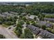 Aerial view of the townhome community with pool and tennis courts at 2630 Milford Ln, Alpharetta, GA 30009