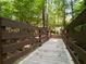 Picturesque wooden bridge overlooks wooded scenery at 2630 Milford Ln, Alpharetta, GA 30009