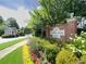 Academy Park sign with lush landscaping in front at 2630 Milford Ln, Alpharetta, GA 30009
