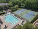 Community pool, lounge chairs, tables, and tennis courts at 2630 Milford Ln, Alpharetta, GA 30009