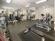 This gym features free weights, weight machines, ceiling fans, and mirrored walls at 2630 Milford Ln, Alpharetta, GA 30009