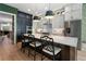 Modern kitchen with stainless steel appliances, a large island, and stylish bar stools at 2630 Milford Ln, Alpharetta, GA 30009