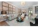 Elegant living room features sophisticated decor, a stylish sofa, and unique map artwork at 2630 Milford Ln, Alpharetta, GA 30009