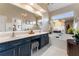 Spa-like main bathroom with dual sinks, a soaking tub, and elegant decor for a relaxing experience at 2630 Milford Ln, Alpharetta, GA 30009