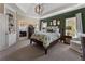 Serene main bedroom suite with tray ceilings, calming color scheme, and ample natural light at 2630 Milford Ln, Alpharetta, GA 30009