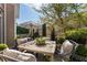 Beautifully decorated outdoor dining area with comfortable seating and lush landscaping, ideal for entertaining at 2630 Milford Ln, Alpharetta, GA 30009