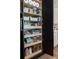 Open pantry with pull out shelves stocked with food containers, snacks, and drinks at 2630 Milford Ln, Alpharetta, GA 30009