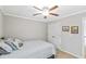 This bedroom has neutral colors, a ceiling fan, double-door closet, and ample natural light at 5775 Stephens Mill Dr, Sugar Hill, GA 30518