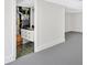 Partially finished basement with white walls, grey floors, and utility area at 111 Evergreen Trl, Cartersville, GA 30121