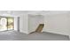 Unfinished basement featuring a walkout sliding glass door and stairs at 111 Evergreen Trl, Cartersville, GA 30121