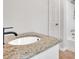 Bathroom sink and shower area featuring granite counters and modern fixtures at 111 Evergreen Trl, Cartersville, GA 30121