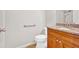 Bathroom featuring a wood vanity with a granite countertop and a shower at 111 Evergreen Trl, Cartersville, GA 30121
