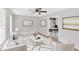 Bright living room featuring stylish decor, a modern ceiling fan, and an open layout at 111 Evergreen Trl, Cartersville, GA 30121