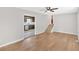 Spacious living area featuring hardwood floors, stairs to the second floor, and an open view to the kitchen at 111 Evergreen Trl, Cartersville, GA 30121