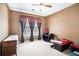 Bedroom with neutral paint, a fan, window and furniture at 1218 Cabots Ln, Auburn, GA 30011