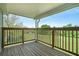 Inviting wooden deck overlooking the backyard, perfect for outdoor relaxation at 1218 Cabots Ln, Auburn, GA 30011