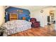 Cozy living room featuring hardwood floors and a comfortable floral sofa and chair at 1218 Cabots Ln, Auburn, GA 30011