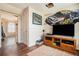Living room displaying media center with flat screen television and doorway at 1218 Cabots Ln, Auburn, GA 30011
