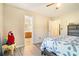 Comfortable main bedroom with an en-suite bathroom and a parrot at 1218 Cabots Ln, Auburn, GA 30011