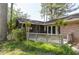 Backyard with wooden deck, lattice fence, and lush landscaping creating a private outdoor space at 1629 Anita Ne Pl, Atlanta, GA 30306