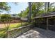 The backyard boasts a wooden deck with a charming lattice fence and serene green landscaping at 1629 Anita Ne Pl, Atlanta, GA 30306