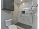 A modern bathroom boasts a tiled shower with glass doors and a cabinet at 1629 Anita Ne Pl, Atlanta, GA 30306