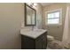 Stylish bathroom features a granite-look vanity, a modern faucet, and a framed mirror at 1629 Anita Ne Pl, Atlanta, GA 30306